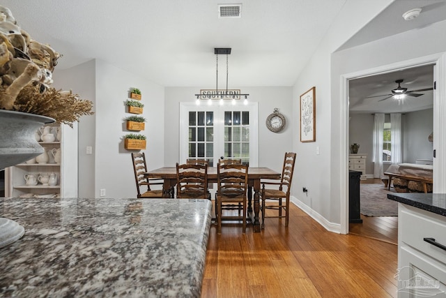 1333 Dubose Rd, Gulf Breeze, FL 32563 - dining area with wood finished floors, ceiling fan, and baseboards