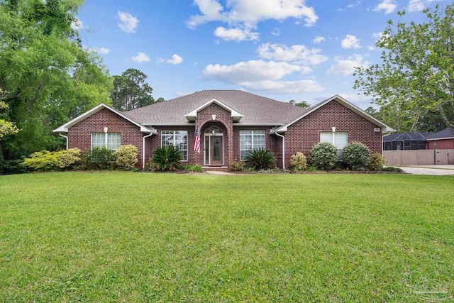 1333 Dubose Rd, Gulf Breeze, FL 32563 - ranch-style home with brick siding, a front lawn, and roof with shingles