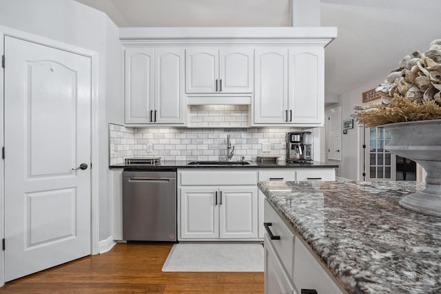 1333 Dubose Rd, Gulf Breeze, FL 32563 - kitchen featuring dishwasher, a sink, dark wood-style flooring, dark stone countertops, and backsplash