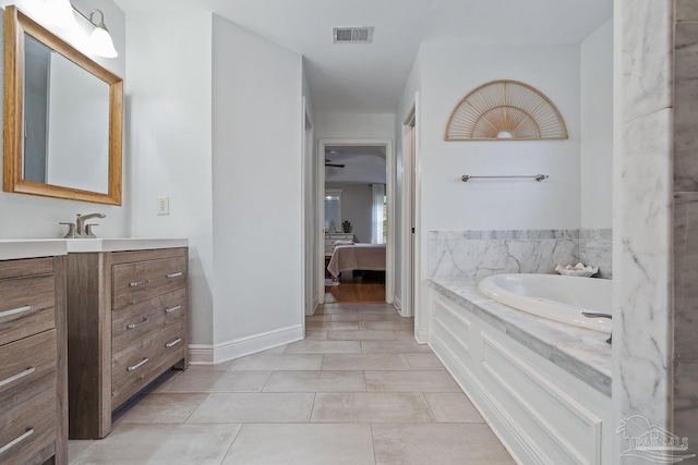 1333 Dubose Rd, Gulf Breeze, FL 32563 - full bath with ensuite bath, tile patterned floors, vanity, a bath, and baseboards