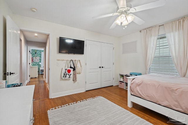 1333 Dubose Rd, Gulf Breeze, FL 32563 - bedroom featuring light wood-type flooring, multiple windows, baseboards, and a closet