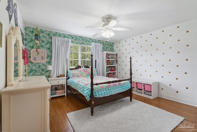 1333 Dubose Rd, Gulf Breeze, FL 32563 - bedroom with wallpapered walls, wood finished floors, and a ceiling fan