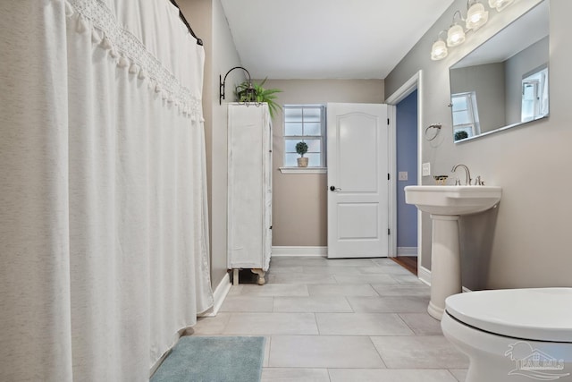 1333 Dubose Rd, Gulf Breeze, FL 32563 - full bathroom with tile patterned flooring, baseboards, and toilet