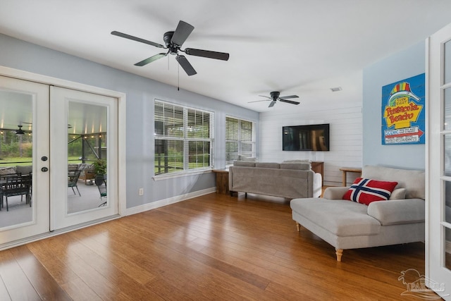 1333 Dubose Rd, Gulf Breeze, FL 32563 - living area featuring wood finished floors, a ceiling fan, french doors, and baseboards