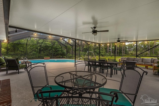 1333 Dubose Rd, Gulf Breeze, FL 32563 - view of patio / terrace featuring outdoor lounge area, outdoor dining area, an outdoor pool, ceiling fan, and glass enclosure