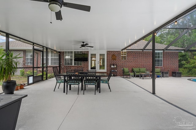 1333 Dubose Rd, Gulf Breeze, FL 32563 - view of patio featuring ceiling fan, outdoor dining area, and glass enclosure
