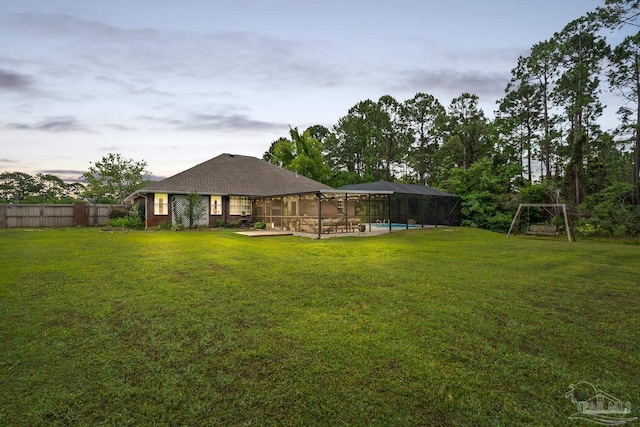 1333 Dubose Rd, Gulf Breeze, FL 32563 - yard at dusk with glass enclosure