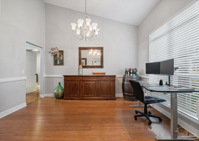 1333 Dubose Rd, Gulf Breeze, FL 32563 - office area with a chandelier, light wood-type flooring, high vaulted ceiling, and baseboards