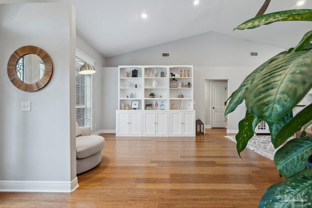 1333 Dubose Rd, Gulf Breeze, FL 32563 - living area with light wood-type flooring, baseboards, and lofted ceiling