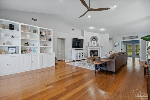 1333 Dubose Rd, Gulf Breeze, FL 32563 - living area with ceiling fan, light wood-style flooring, a fireplace, lofted ceiling, and french doors