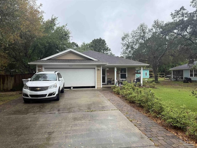 5407 Maverick Ln, Gulf Breeze, FL 32563 - ranch-style home featuring a front yard, a porch, an attached garage, fence, and concrete driveway
