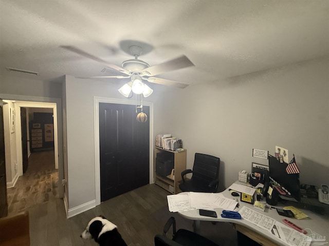 5407 Maverick Ln, Gulf Breeze, FL 32563 - home office featuring visible vents, ceiling fan, baseboards, and dark wood-style floors
