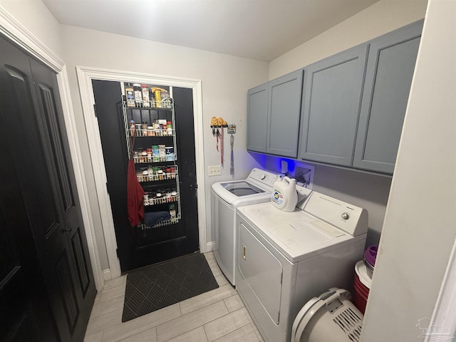 5407 Maverick Ln, Gulf Breeze, FL 32563 - clothes washing area featuring cabinet space and washer and dryer