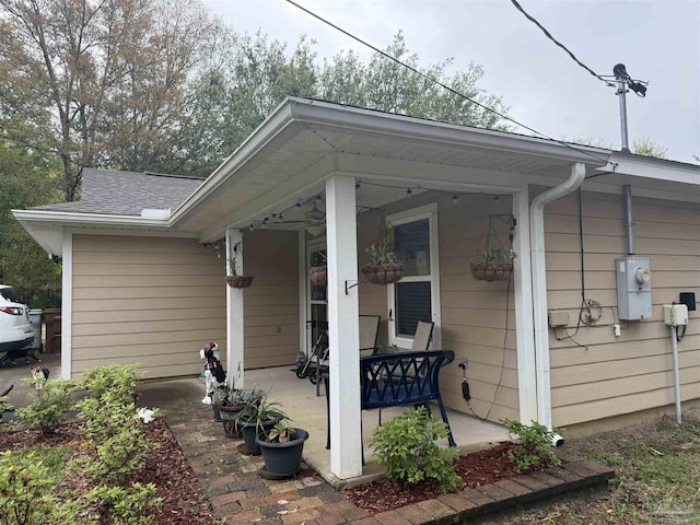 5407 Maverick Ln, Gulf Breeze, FL 32563 - exterior space featuring a porch and a shingled roof