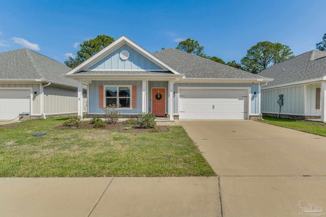 view of front facade featuring a garage and a front lawn