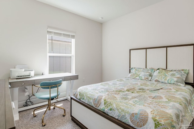 bedroom featuring light carpet