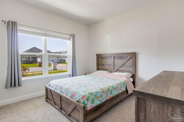 bedroom with light colored carpet