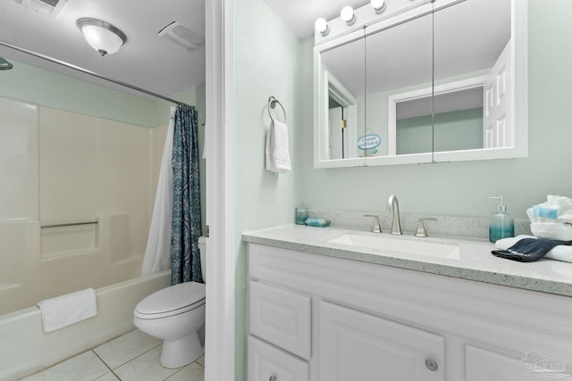 full bathroom with shower / bath combo with shower curtain, tile patterned floors, toilet, and vanity