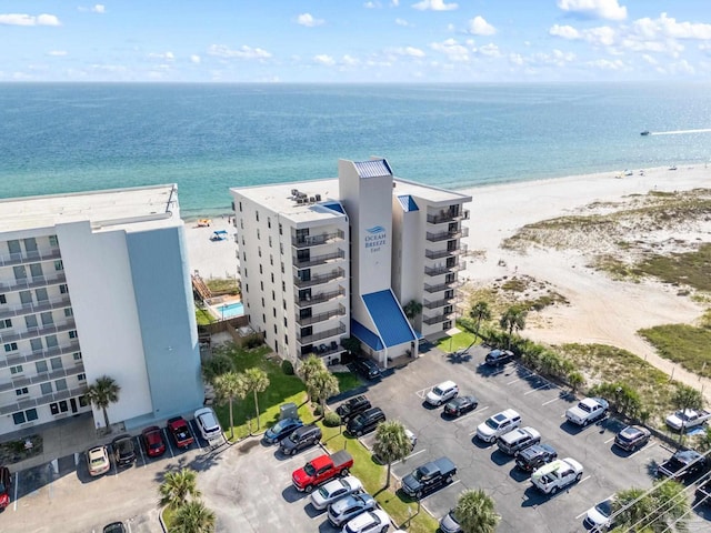 birds eye view of property featuring a water view and a view of the beach