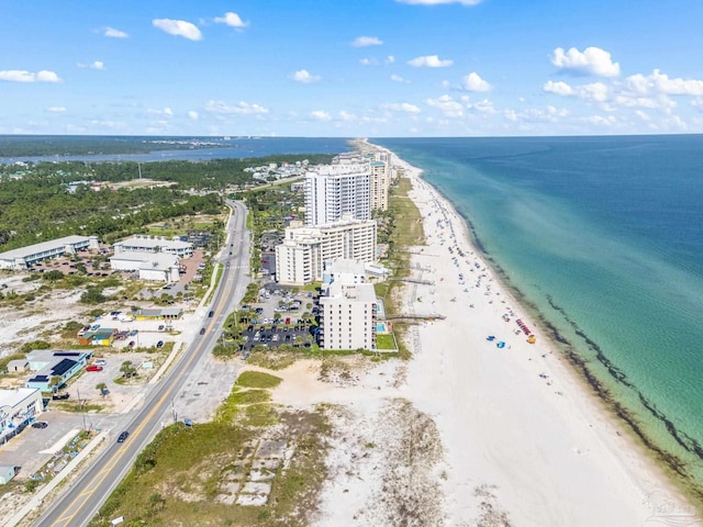 birds eye view of property with a view of the beach and a water view