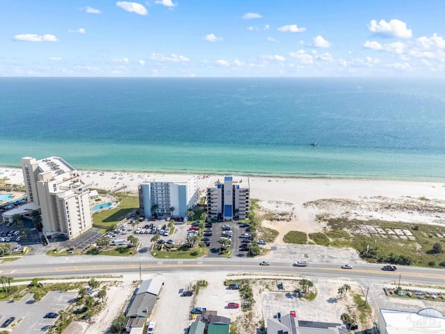 bird's eye view with a water view and a view of the beach