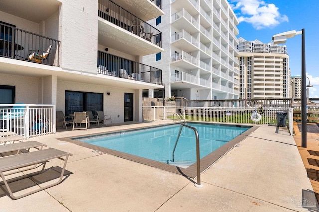 view of pool featuring a patio area