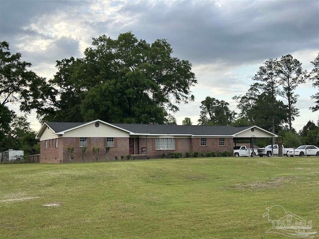 single story home with a carport and a front yard