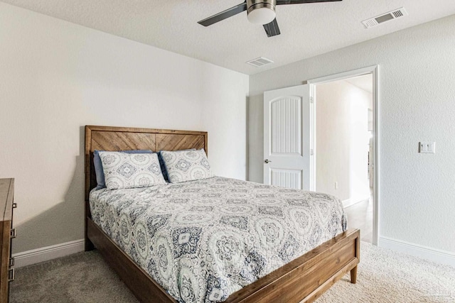 bedroom featuring ceiling fan and dark colored carpet