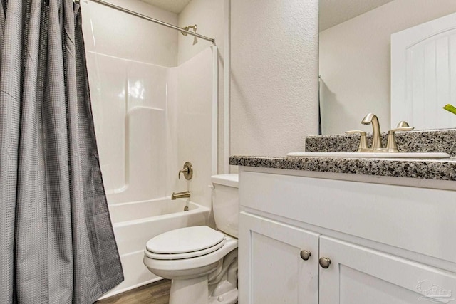 full bathroom with wood-type flooring, toilet, vanity, and shower / bath combo