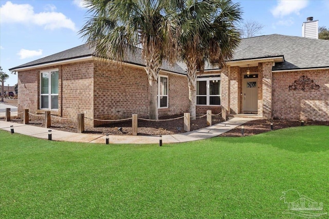 back of house with a yard