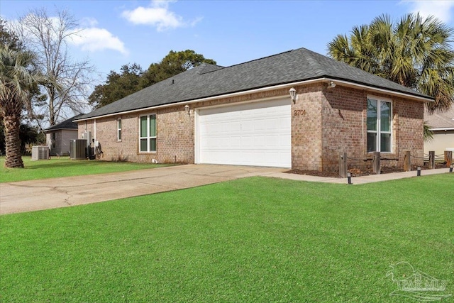 view of front of property with a garage, a front lawn, and central air condition unit