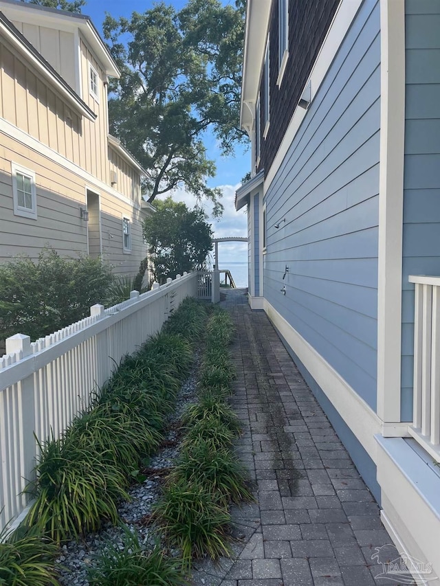16 Duncan Ave, Gulf Breeze, FL 32561 - view of home's exterior with board and batten siding and a fenced backyard
