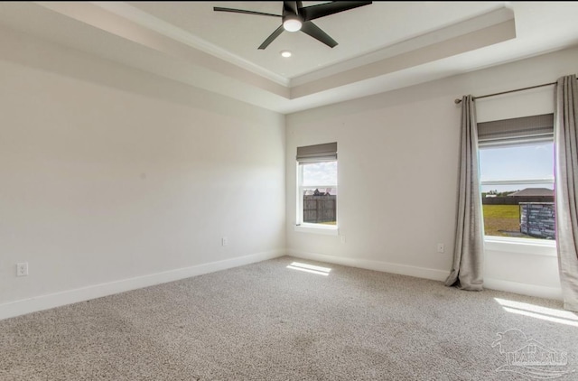 carpeted empty room with a tray ceiling, baseboards, ceiling fan, and recessed lighting