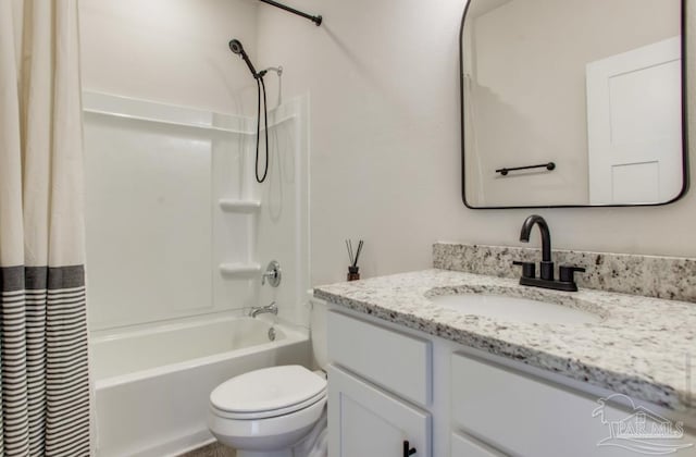 bathroom with toilet, vanity, and shower / bathtub combination with curtain