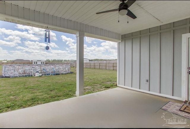 view of patio / terrace featuring fence and a ceiling fan