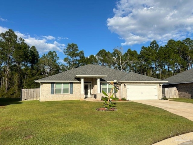 view of front facade with a front yard and a garage