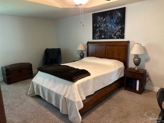 carpeted bedroom with ceiling fan