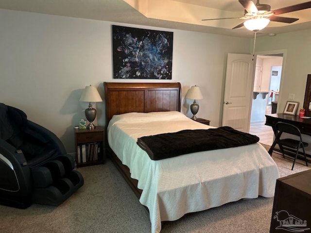 bedroom featuring ceiling fan and light carpet