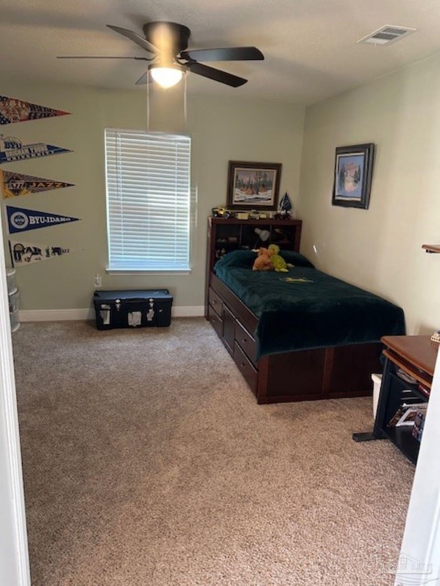 carpeted bedroom with ceiling fan