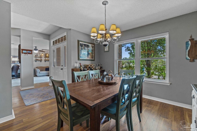 1265 Grand Ridge Cir, Gulf Breeze, FL 32563 - dining area featuring a chandelier, wood finished floors, baseboards, a textured ceiling, and a ceiling fan