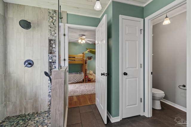 1265 Grand Ridge Cir, Gulf Breeze, FL 32563 - ensuite bathroom featuring tiled shower, toilet, a ceiling fan, and baseboards