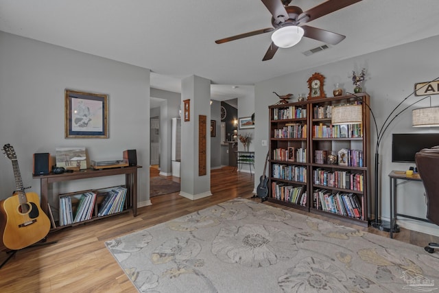 1265 Grand Ridge Cir, Gulf Breeze, FL 32563 - sitting room featuring ceiling fan, wood finished floors, and baseboards