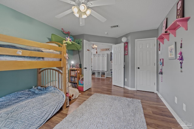 1265 Grand Ridge Cir, Gulf Breeze, FL 32563 - bedroom with wood finished floors, baseboards, and a ceiling fan