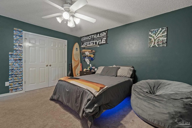 1265 Grand Ridge Cir, Gulf Breeze, FL 32563 - carpeted bedroom featuring a textured ceiling, a ceiling fan, a closet, and baseboards