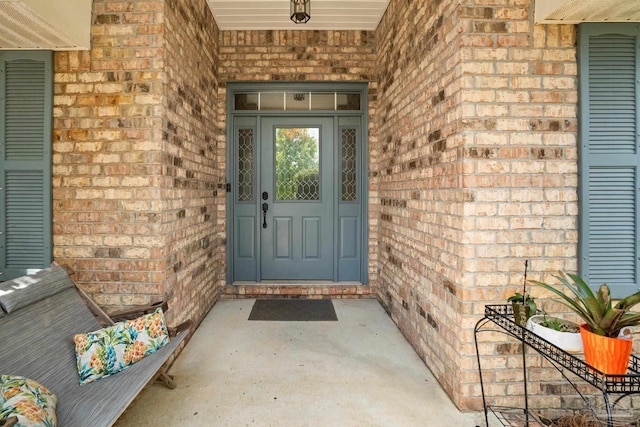 1265 Grand Ridge Cir, Gulf Breeze, FL 32563 - entrance to property with brick siding and a porch