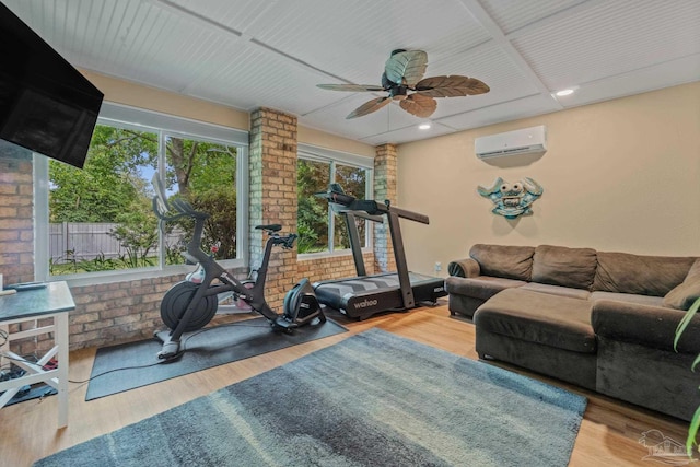 1265 Grand Ridge Cir, Gulf Breeze, FL 32563 - exercise area with a wall mounted air conditioner, a ceiling fan, wood finished floors, and recessed lighting