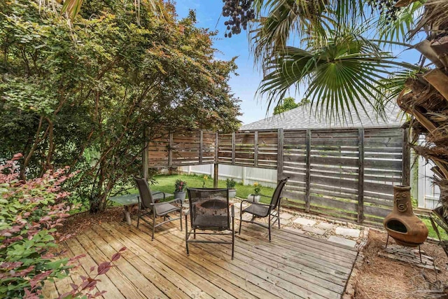 1265 Grand Ridge Cir, Gulf Breeze, FL 32563 - wooden terrace featuring an outdoor fire pit and a fenced backyard