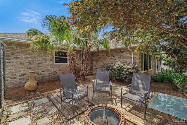 1265 Grand Ridge Cir, Gulf Breeze, FL 32563 - view of patio featuring an outdoor fire pit