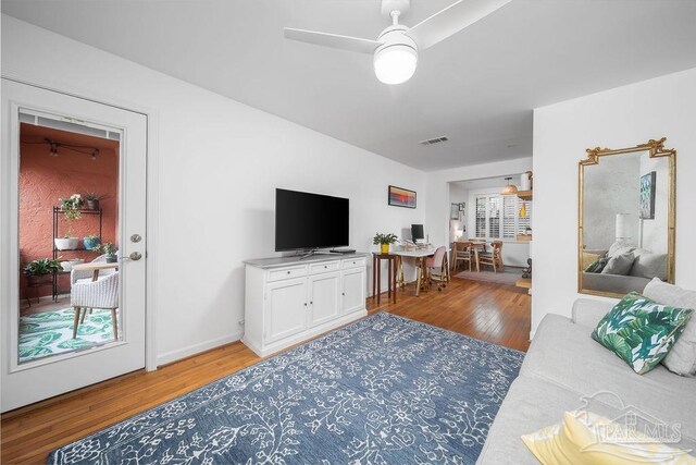 home office with light hardwood / wood-style flooring