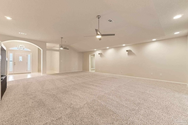 interior space featuring carpet flooring, ceiling fan, and lofted ceiling